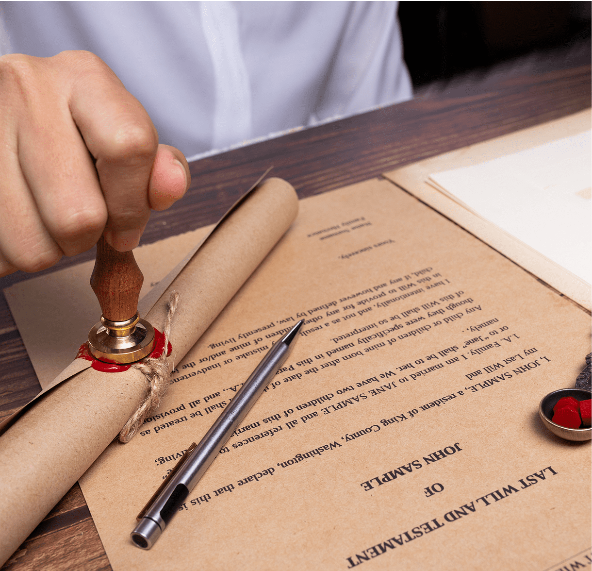Sealing a document with a wax seal.